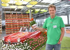 Wout Vollebregt, Sales manager at Perry van den Haak, holding a Toscana Ronja. In the back we see a beautiful retro Alfa Romeo.